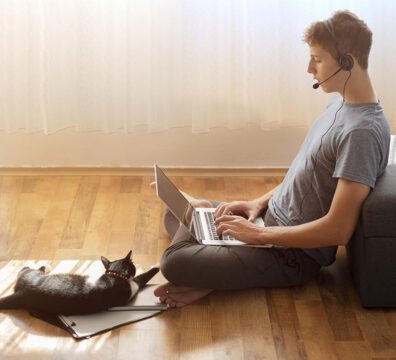 side-view-of-man-using-laptop-at-home-in-quarantine-to-work